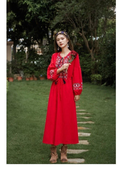 Elegant embroidered cotton-linen dress with tassels, featuring a waist-cinching A-line silhouette in vibrant colors