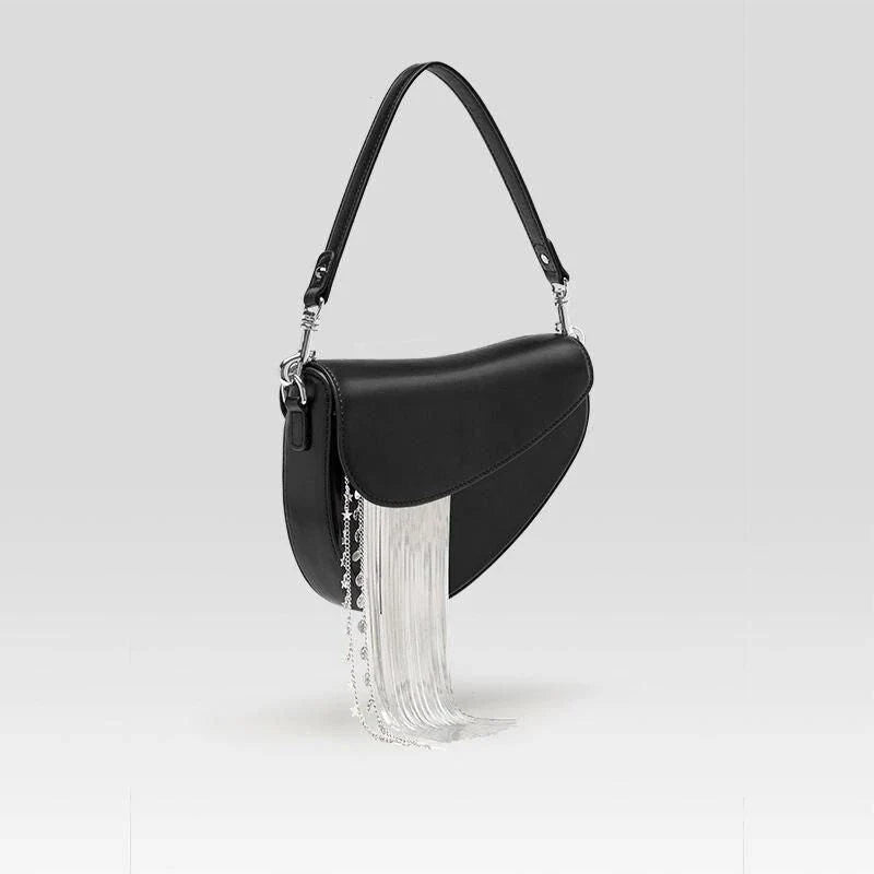 Premium leather crossbody saddle bag with stylish tassel detail, perfect for everyday use or formal occasions.