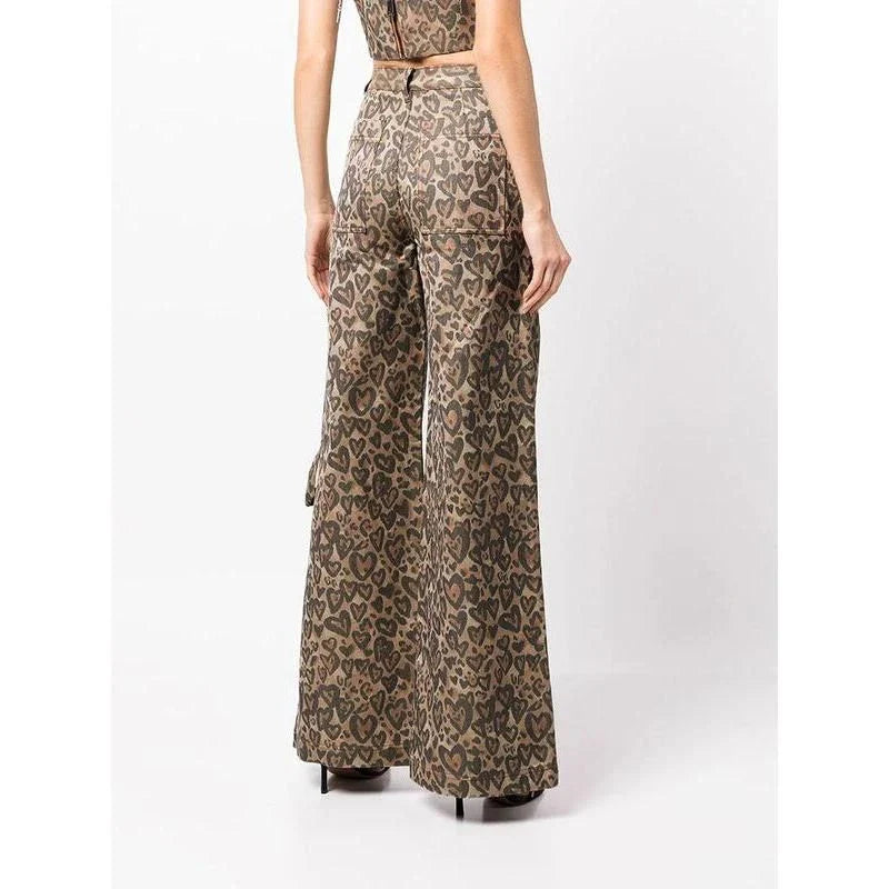 Chic high-waisted patchwork leopard print denim trousers with rivet details and wide-leg silhouette