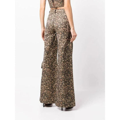Chic high-waisted patchwork leopard print denim trousers with rivet details and wide-leg silhouette