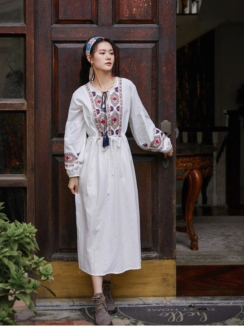 Elegant embroidered cotton-linen dress with tassels, featuring a waist-cinching A-line silhouette in vibrant colors