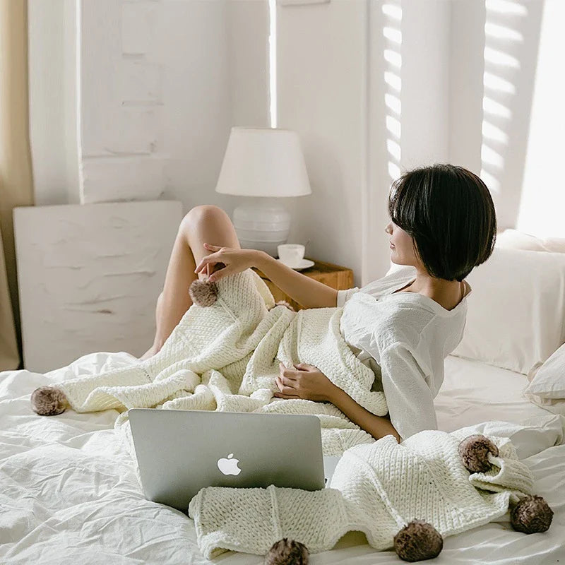 Cozy chenille ball-knit wool blanket in pink, gray, and white colors