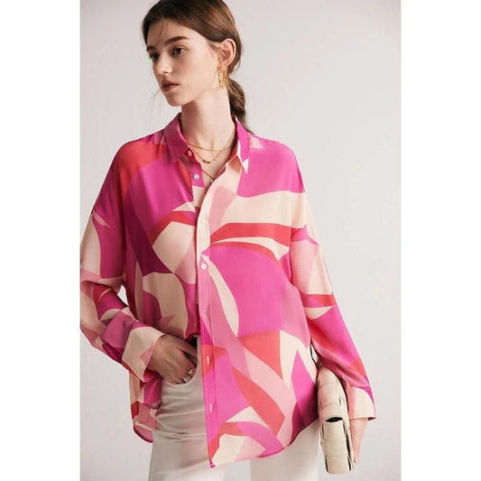 Elegant silk crepe de chine blouse in a unique print design, featuring a loose, straight fit and full-length drop sleeves for a modern, sophisticated look.