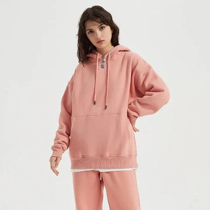 Cozy Fleece Hoodie and Sweatpants Set in Light Pink, featuring a relaxed fit and hooded design for maximum comfort and style.