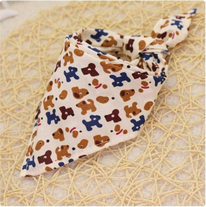 Adorable Cartoon Patterned Triangular Dog Scarf in vibrant colors, perfect for keeping your pup warm and stylish