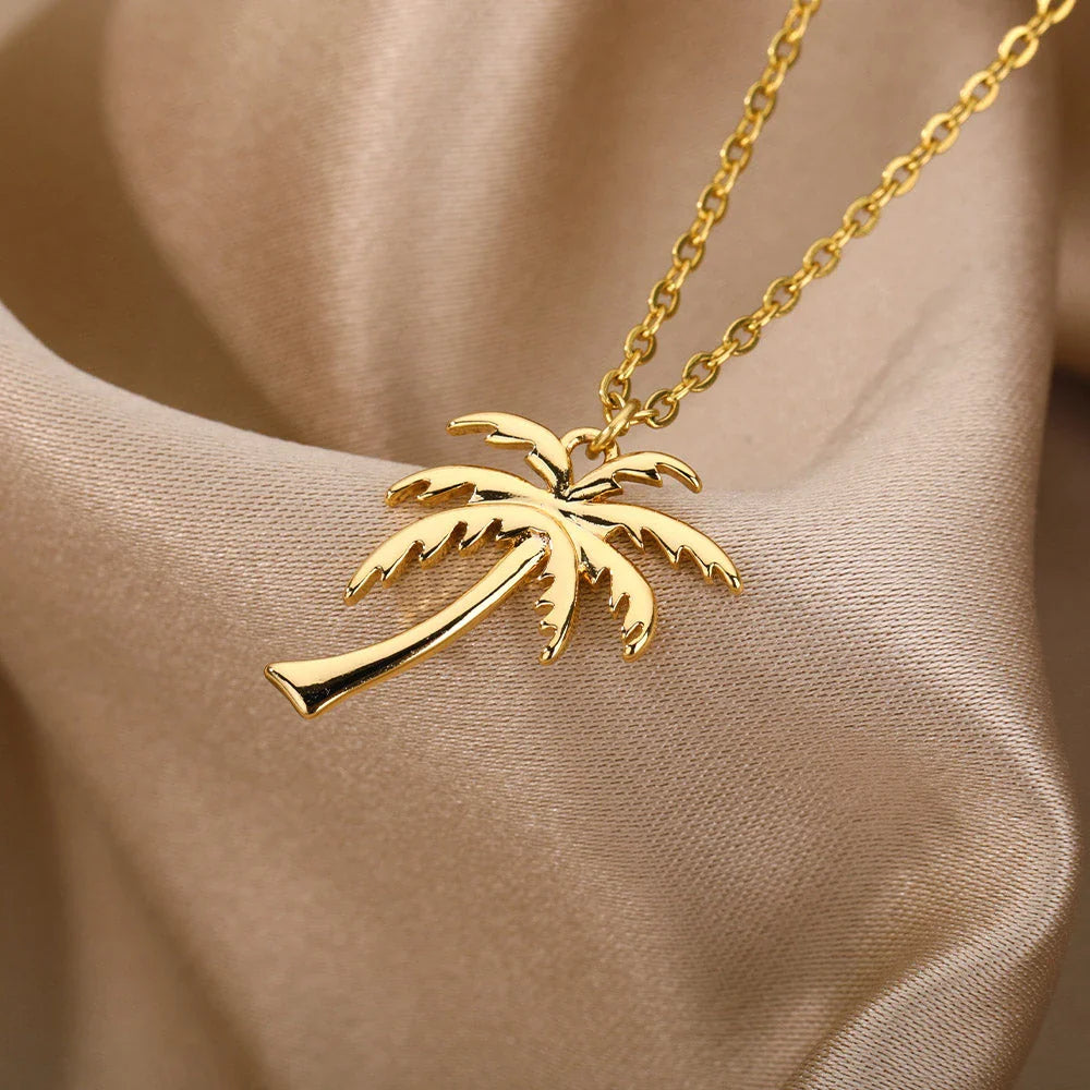 Stainless steel palm tree pendant necklace with sleek chain, perfect for summer beach style and bohemian fashion