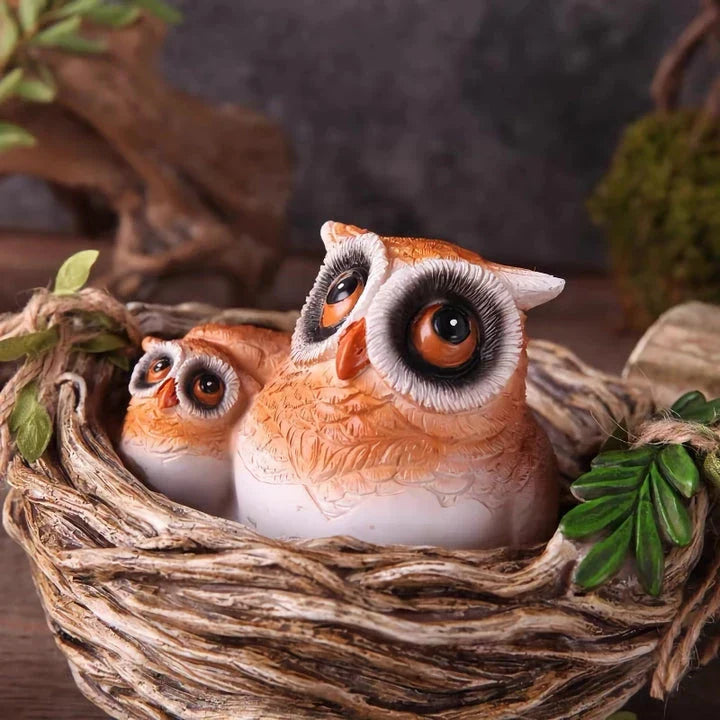 High-quality resin sculpture of a mother owl and her baby nestled in a cozy nest, perfect for adding natural charm to home and garden decor