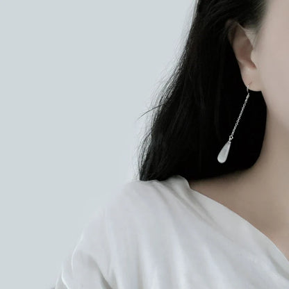 925 Sterling Silver Opal Drop Earrings with a sleek and sophisticated design, perfect for adding a touch of elegance to any outfit.