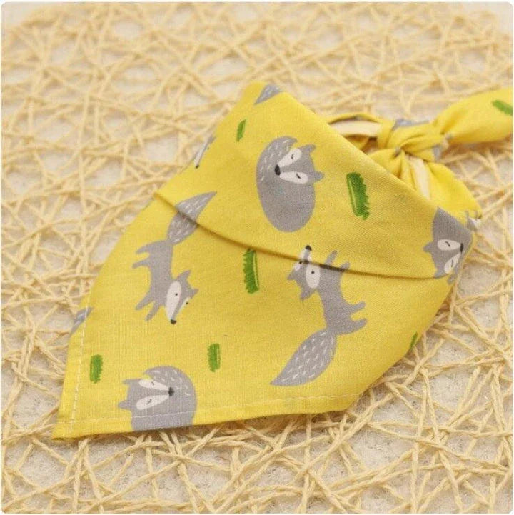 Adorable Cartoon Patterned Triangular Dog Scarf in vibrant colors, perfect for keeping your pup warm and stylish
