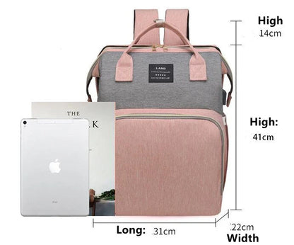 Multifunctional maternity diaper backpack with detachable crib, large capacity, and water-resistant design for travel