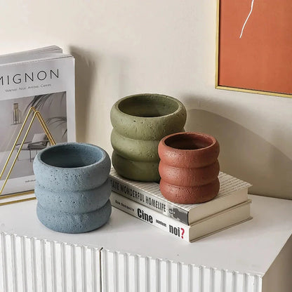 Modern minimalist cement flower pot with Nordic-inspired design, available in small and medium sizes for indoor and outdoor use