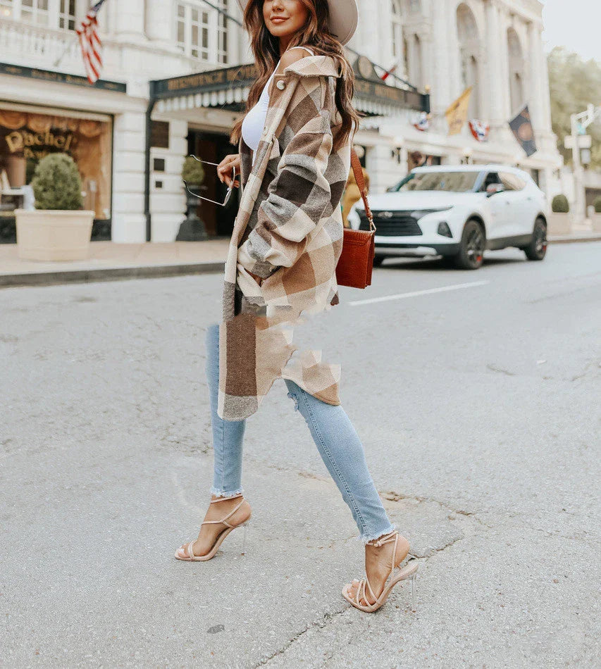 A fashionable women's plaid woolen jacket with a relaxed fit, featuring a timeless plaid pattern and polyester construction for comfort and durability.