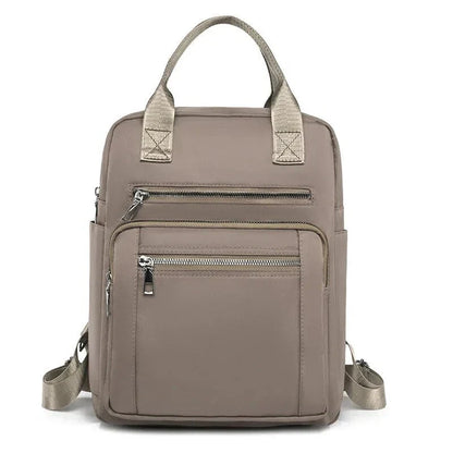 A stylish and durable Oxford cloth backpack with multiple compartments for organized storage and a sleek, portable design.