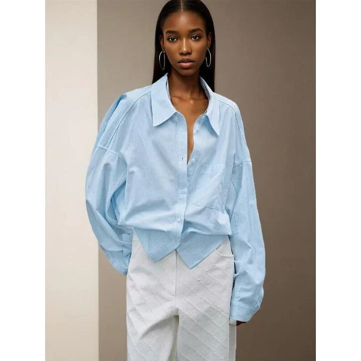 Chic patchwork blouse with functional pockets, perfect for casual and semi-formal occasions