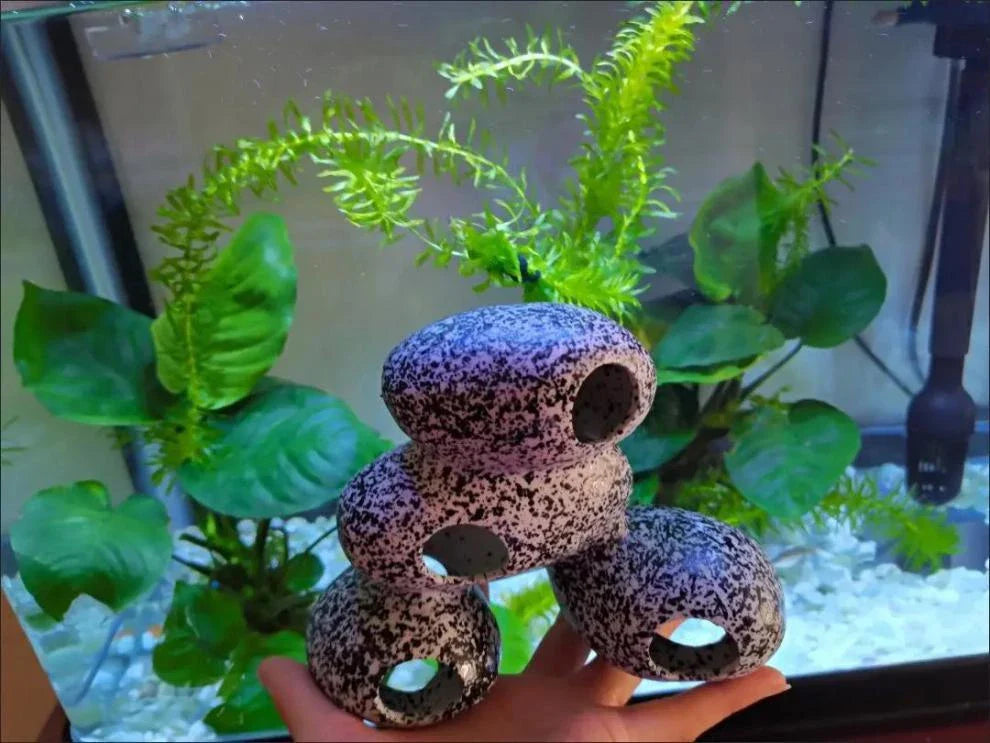 Realistic and natural-looking fish tank decor made of premium resin material, designed to provide a safe haven for fish and shrimp breeding and hiding