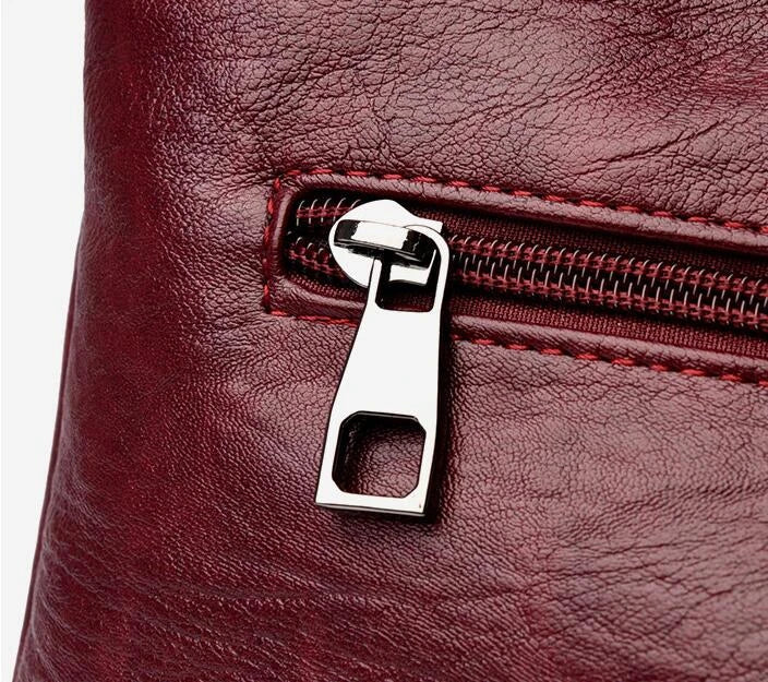 Stylish one-shoulder messenger bag in various colors with a soft, supple PU leather exterior and a spacious, organized main compartment