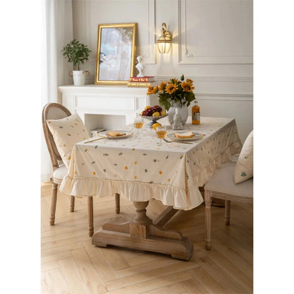 Elegant cotton tablecloth with apricot embroidery and lotus leaf edge, perfect for dining decor