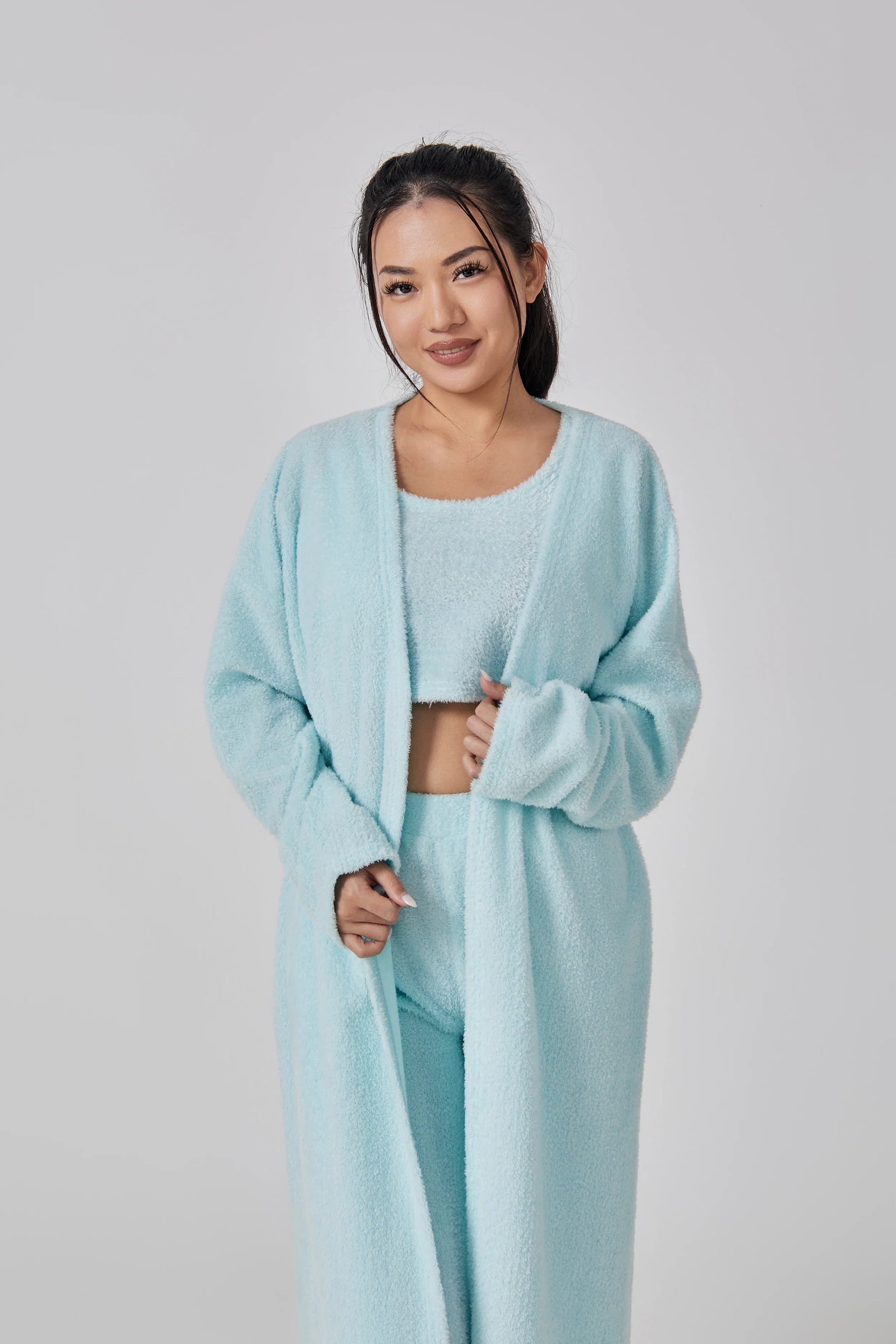 Cozy 3-piece loungewear set in pastel colors including crop top, wide-leg pants, and matching cardigan
