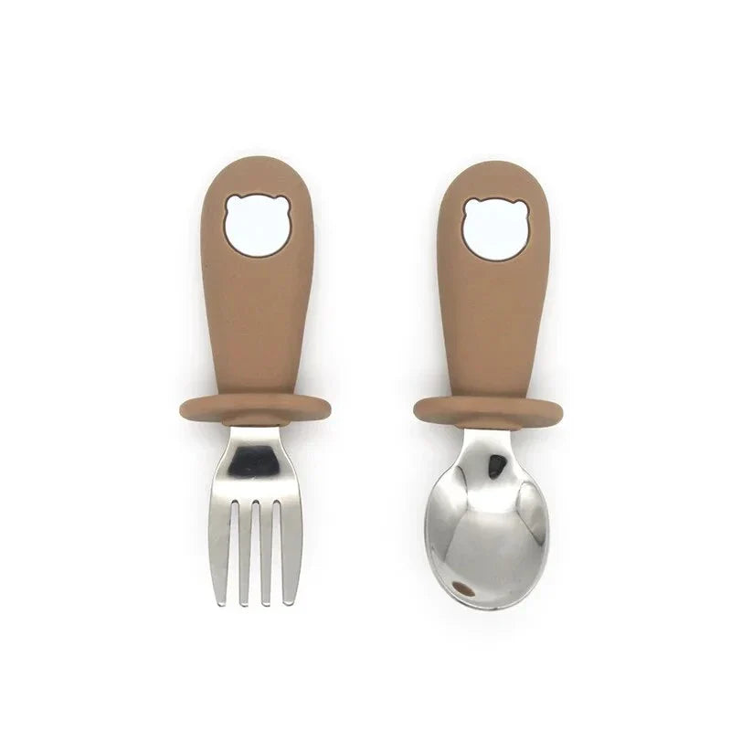 Cartoon Stainless Steel Kids' Cutlery Set with spoon and fork in playful designs, perfect for toddler and child mealtime