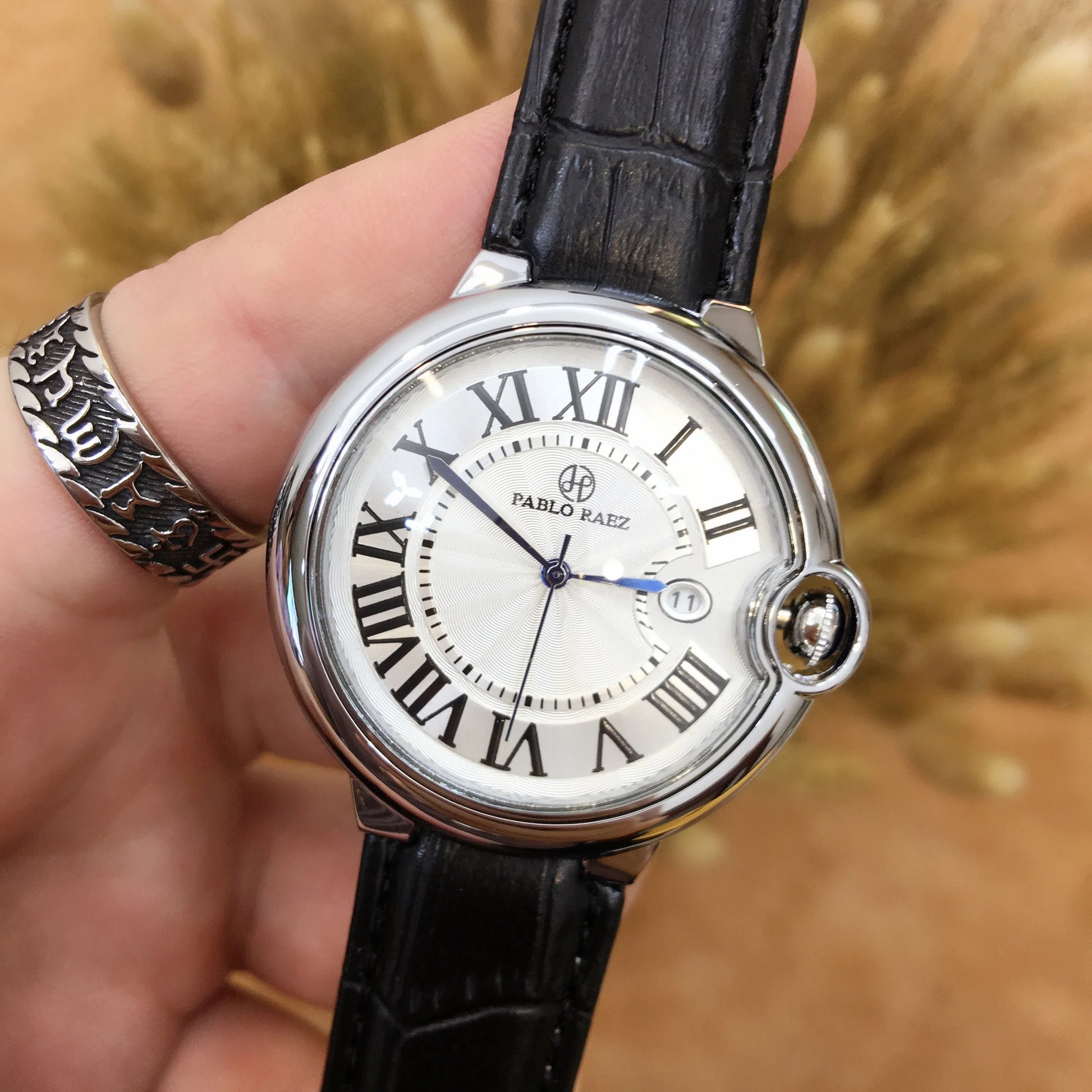 Stainless steel men's watch with large dial, calendar function, and adjustable band