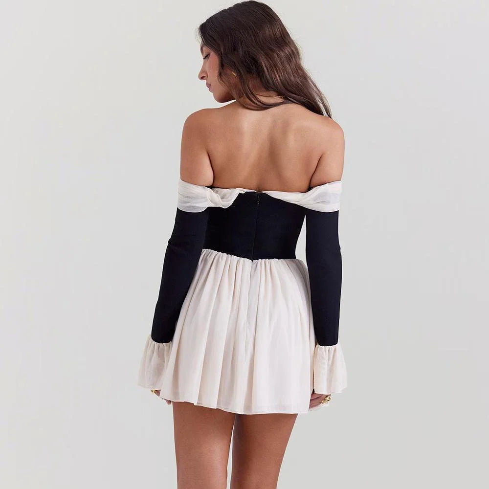 Captivating strapless backless mini dress with flared sleeves in a patchwork pattern, perfect for parties and events