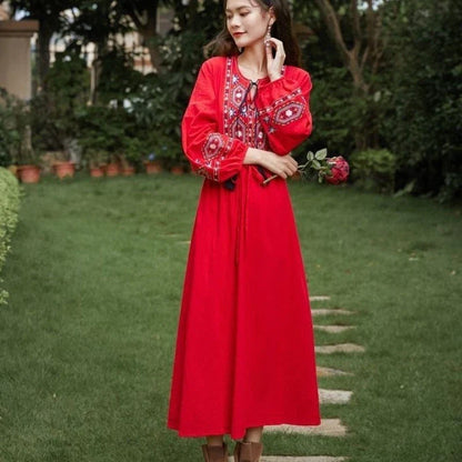 Elegant embroidered cotton-linen dress with tassels, featuring a waist-cinching A-line silhouette in vibrant colors