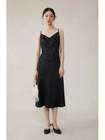 Elegant mint green midi dress with spaghetti straps, featuring a slim fit and intricate embroidery details