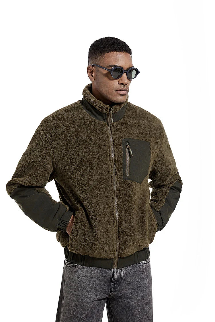 A cozy and stylish men's fleece jacket with a standing collar and convenient side pockets, available in a range of classic colors.