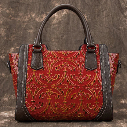 A fashionable large capacity leather shoulder bag for women in a vintage-inspired floral design with multiple interior pockets for organization.