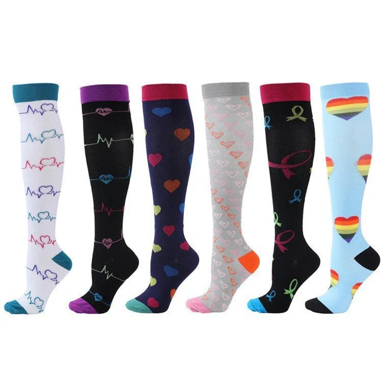 Pairs of long tube compression sports socks in a variety of stylish color combinations