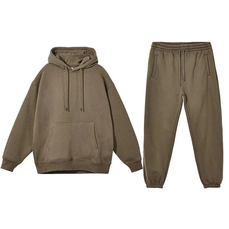 Cozy Fleece Hoodie and Sweatpants Set in Light Pink, featuring a relaxed fit and hooded design for maximum comfort and style.