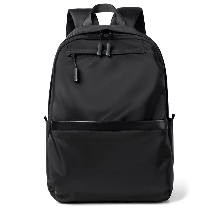A large, simple, and stylish backpack made of durable nylon material with multiple compartments for organized storage and comfortable shoulder straps for easy carry.