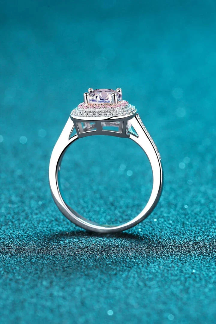 A stunning moissanite ring with a captivating center stone and a hand-polished 925 sterling silver setting, perfect for everyday elegance.