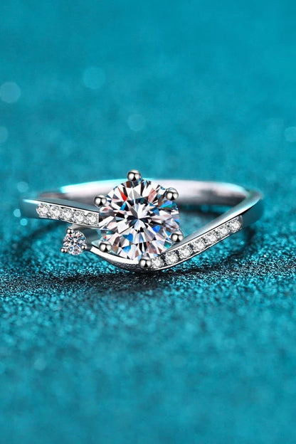 Elegant 925 sterling silver moissanite ring with a dazzling center stone and rhodium-plated finish