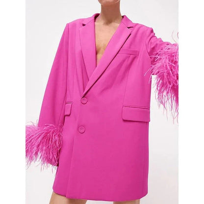 Stylish pink feather-embellished blazer with notched collar, perfect for adding sophistication to any outfit