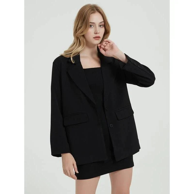 Elegant women's black blazer coat with a turn-down collar, single-breasted closure, and practical pockets for a polished, professional look.