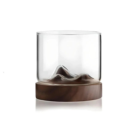 Elegant mountain-inspired whiskey glass with a wooden base, perfect for enjoying a variety of hot and cold beverages
