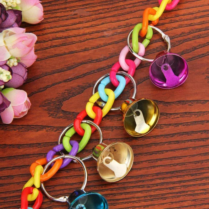 Hanging acrylic bird bells that sway and chime, attracting and entertaining backyard birds