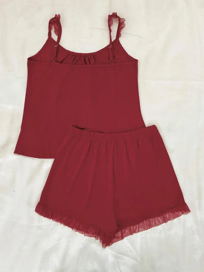 Chic Sleeveless Top and Shorts Set in Black, featuring a flattering scoop neckline, slightly stretchy fabric, and adjustable waistband for a comfortable, customized fit.