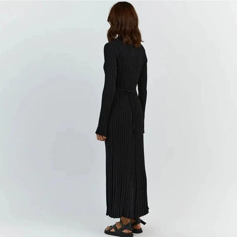 Timeless elegant pleated knit dress in black, perfect for summer office wear with a sophisticated and comfortable design.