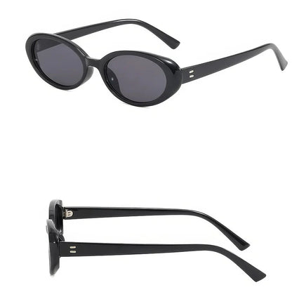 Chic oval sunglasses with white grey acetate frames and polycarbonate lenses, designed for fashionable women to shield their eyes from UV rays in style.