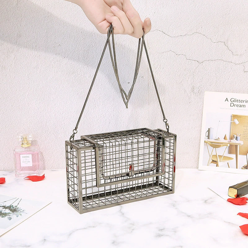 Metal shoulder bag with iron mesh design, adjustable chain strap, and compact size for versatile wear