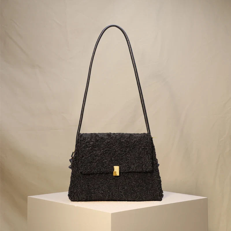 Stylish faux lamb wool crossbody shoulder bag in neutral colors with a cozy, plush exterior and organized interior pockets