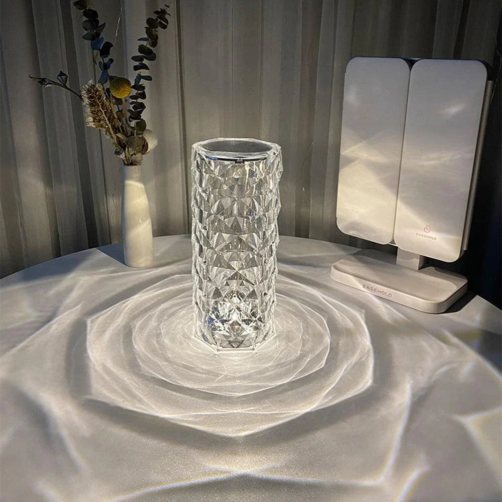 Elegant diamond-inspired crystal lamp with touch-sensitive dimming controls, providing adjustable ambient lighting for bedrooms and living spaces.