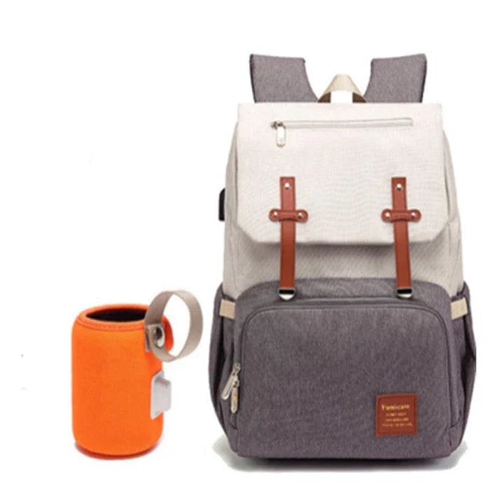Premium diaper backpack with insulated pockets, stroller attachment, and USB charging port