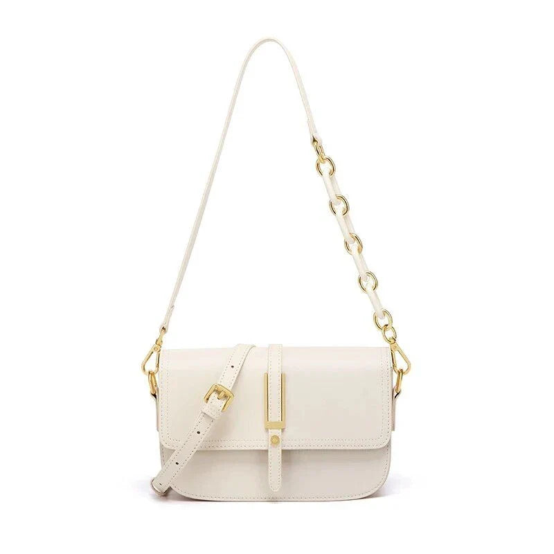 Elegant white leather crossbody bag for women with adjustable strap and multiple interior pockets for organized storage.