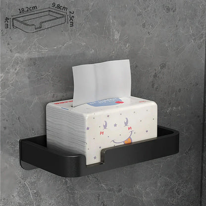 Black and gold aluminum bathroom paper holder with a convenient phone shelf, a stylish and functional accessory for modern bathrooms.