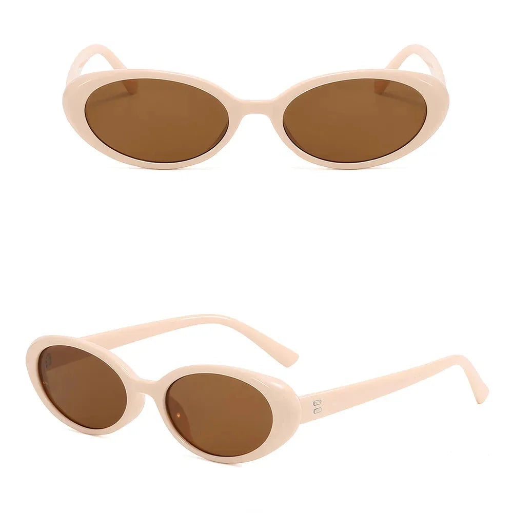 Chic oval sunglasses with white grey acetate frames and polycarbonate lenses, designed for fashionable women to shield their eyes from UV rays in style.