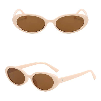 Chic oval sunglasses with white grey acetate frames and polycarbonate lenses, designed for fashionable women to shield their eyes from UV rays in style.