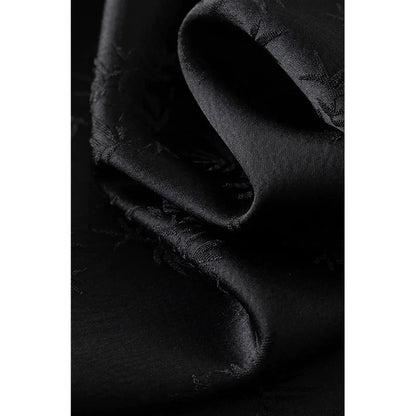 Elegant mint green midi dress with spaghetti straps, featuring a slim fit and intricate embroidery details